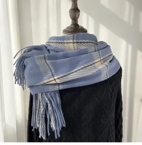 Blue plaid imitation cashmere scarf with chic fringe detail, warm and cozy winter accessory.