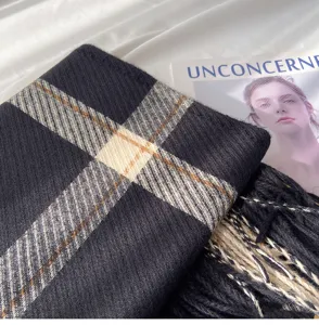Classic plaid winter scarf for women, soft cashmere-feel check shawl with fringe details.