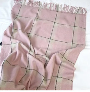 Pink plaid scarf detail showing soft imitation cashmere texture and elegant fringe hem design.