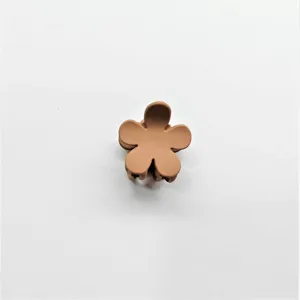Close-up detail view of the cute matte brown mini flower hair claw clip for daily styling.
