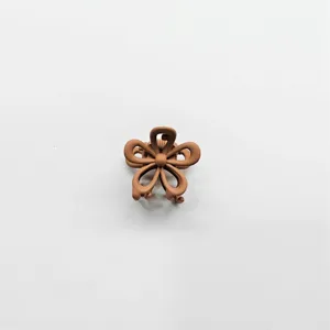 Mini brown matte flower hair claw clip for daily styling, cute hair accessory for women.