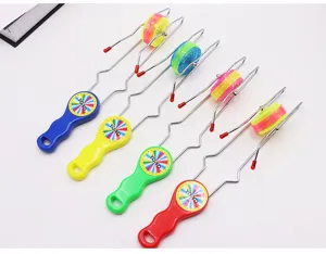 Detail shot of colorful magnetic track flashing yo-yo toys, glowing rollers and metal frames.