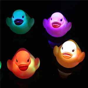 LED water sensing glowing duck toy detail showing colorful lighting effects in dark bath water.
