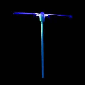 Close-up detail of the glowing blue bamboo dragonfly toy with bright LED light effect.