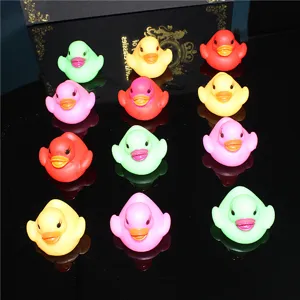 Colorful LED glowing floating rubber duck toy, close-up details for baby bath water play fun.