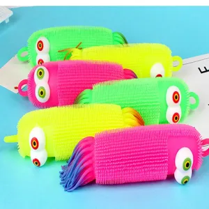 Close up view of colorful sensory caterpillar squeeze toys with pop out eyes and vibrant colors.