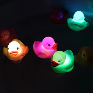 Colorful LED glowing rubber duck toy floating in water, perfect detail shot for baby bath fun.