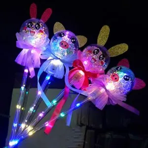 Children LED glowing balloon stick toy with cute animal ears and colorful ribbons for party decor.