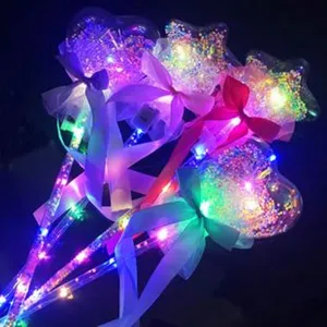 Children glowing magic wand toy with colorful LED lights and cute bow decoration for party use.