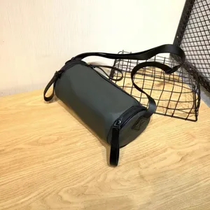Water-resistant nylon cylindrical crossbody bag Japanese style dark solid minimalist shoulder bag