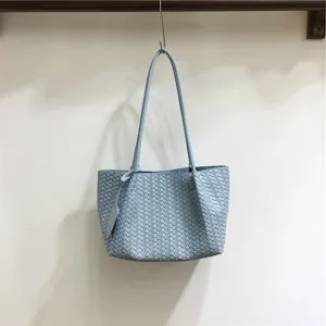 Light blue woven leather shoulder bag, stylish casual underarm tote for daily fashion wear.
