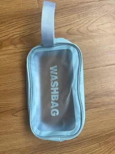 Lichtblauwe doorzichtige draagbare wastas, grote capaciteit reis make-up opbergtas.