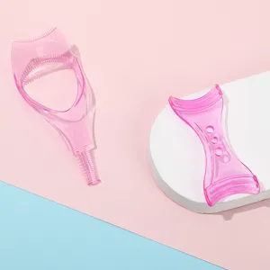 Pink transparent eyelash guard makeup tool detailed view showing dual shaped plastic beauty aids.