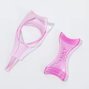 Pink plastic eyelash guard and eyebrow shaping helper makeup tool set for beginners.