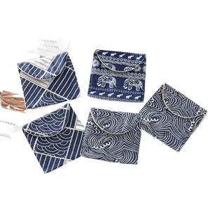 Linda bolsa de almacenamiento de compresas de lino azul y blanco monedero portátil.