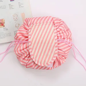 Pink striped drawstring cosmetic bag, large capacity travel makeup storage pouch for women.