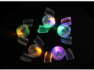 Detail shot of transparent glowing LED mouthguards, multi-color flashing party novelty toys