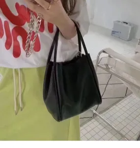 Black bucket bag, stylish minimalist leather shoulder bag for women daily commute.