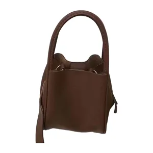 Stylish brown leather handbag and bucket bag, minimalist design for versatile daily wear.