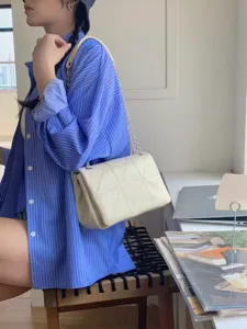 Chic quilted chain shoulder bag for women, versatile crossbody small square bag for daily use.