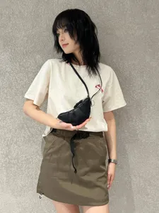 Detailed view of black soft leather croissant crescent bag with strap, stylish daily wear.