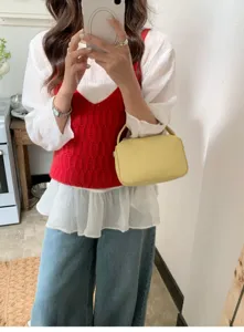 Stylish yellow lunchbox handbag detail shot, daily casual cross-body small square bag.