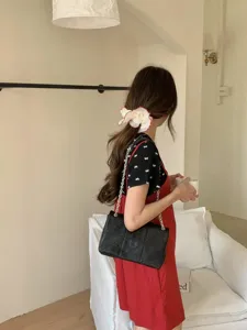 Black quilted chain shoulder bag for women, stylish crossbody bag for spring summer daily.