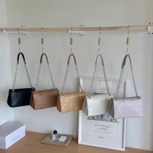 Stylish chain shoulder bag for women, trendy crossbody square bag with elegant quilted design.