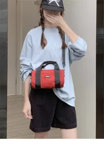 Japanese casual canvas barrel shoulder bag for women, lightweight commuter crossbody bag.