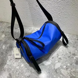Blue nylon cylinder crossbody shoulder bag, waterproof daily casual student messenger bag.
