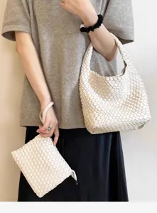 Woven leather shoulder bag set with stylish intrecciato pattern and matching pouch.