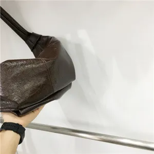 Vintage soft leather pleated shoulder bag, casual brown hobo dumpling bag for women daily use.