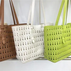 Detail view of hollow out tote bags in brown, white and green. Large capacity shoulder bags.