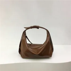 Detailed view of the stylish brown soft leather dumpling underarm shoulder bag design.