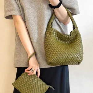 Handwoven green leather bucket bag with matching pouch, versatile everyday shoulder handbag.