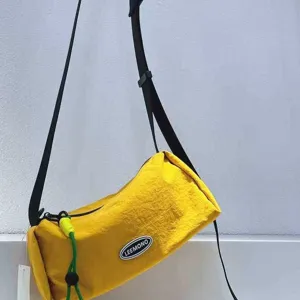 Lightweight casual yellow cylindrical crossbody bag for women, stylish daily canvas shoulder bag.