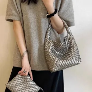 Silver woven leather handbag with matching pouch, stylish everyday tote bag for women.