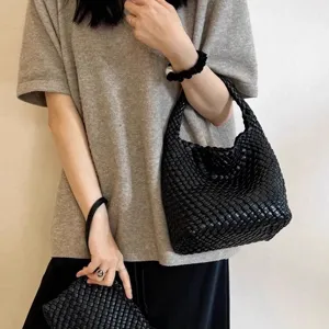 Black woven leather bucket bag, vintage handmade shoulder handbag for women daily casual use.
