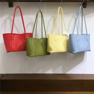 Detailed view of woven leather tote bag showcasing texture and multi-color options.