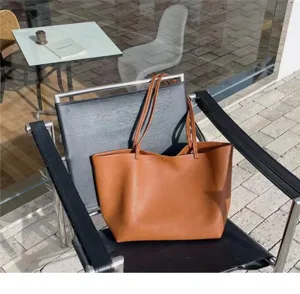 Casual minimalist brown PU leather tote bag for women, soft large capacity shoulder bag.