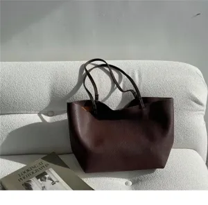 Dark brown slouchy leather shoulder tote bag, casual vintage large capacity design.