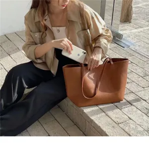 Casual minimalist brown leather tote bag for women, large capacity stylish shoulder bag.