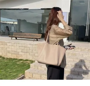 Minimalist slouchy tote bag for women, casual PU leather shoulder bag with large capacity.
