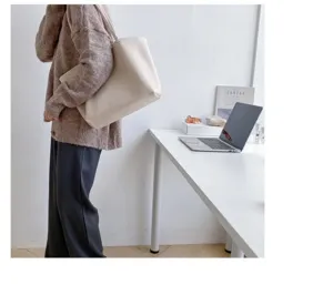 Minimalist slouchy shoulder bag detail, casual aesthetic design with large capacity storage space.
