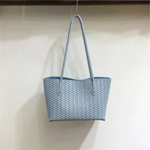 Light blue woven leather shoulder tote bag, classic woven pattern design, soft texture handbag.