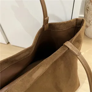 Brown suede tote bag interior detail view, minimalist large capacity shoulder bag showing soft texture.