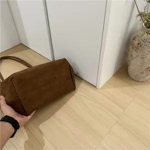 Brown suede large capacity shoulder tote bag detail view, soft texture and chic style.