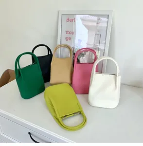 Soft textured leather bucket bag handbag, casual stylish multi-color design detail view.