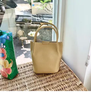 Detail view of the trendy soft leather bucket bag, chic Korean design, versatile handbag.
