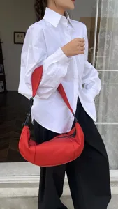 Red nylon crescent shoulder bag, casual minimalist crossbody dumpling bag for daily wear.